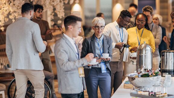 A group of colleagues having breakfast together.