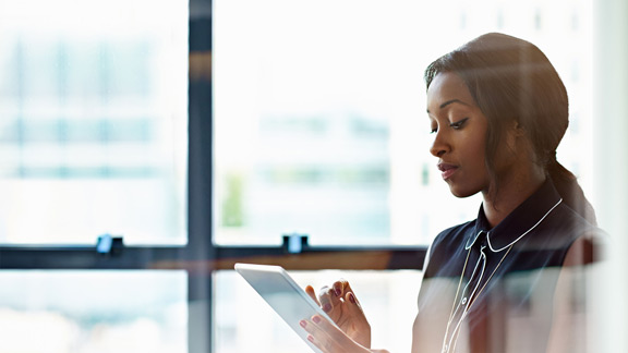 Businesswoman using a digital tablet in office
