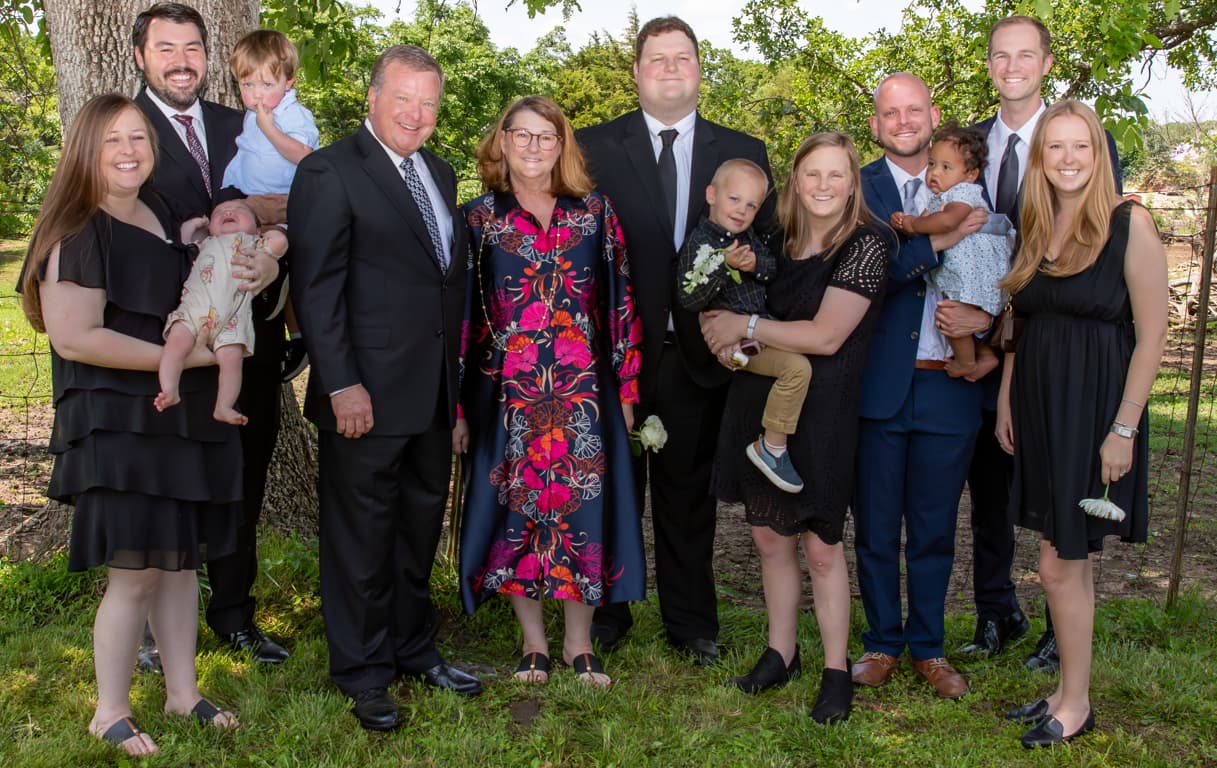 Bill Pickert in a group photo with his wife, children, and grandchildren.