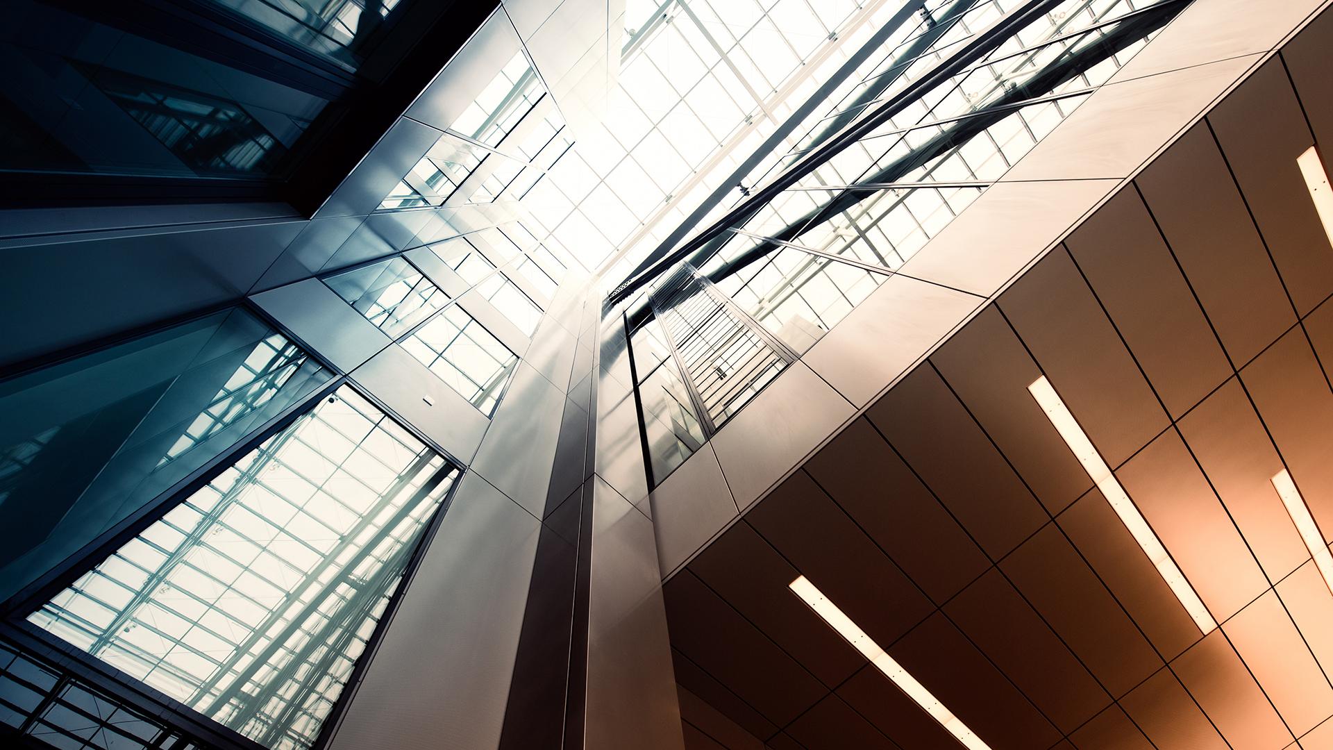 The interior of a modern looking building made of glass and steel