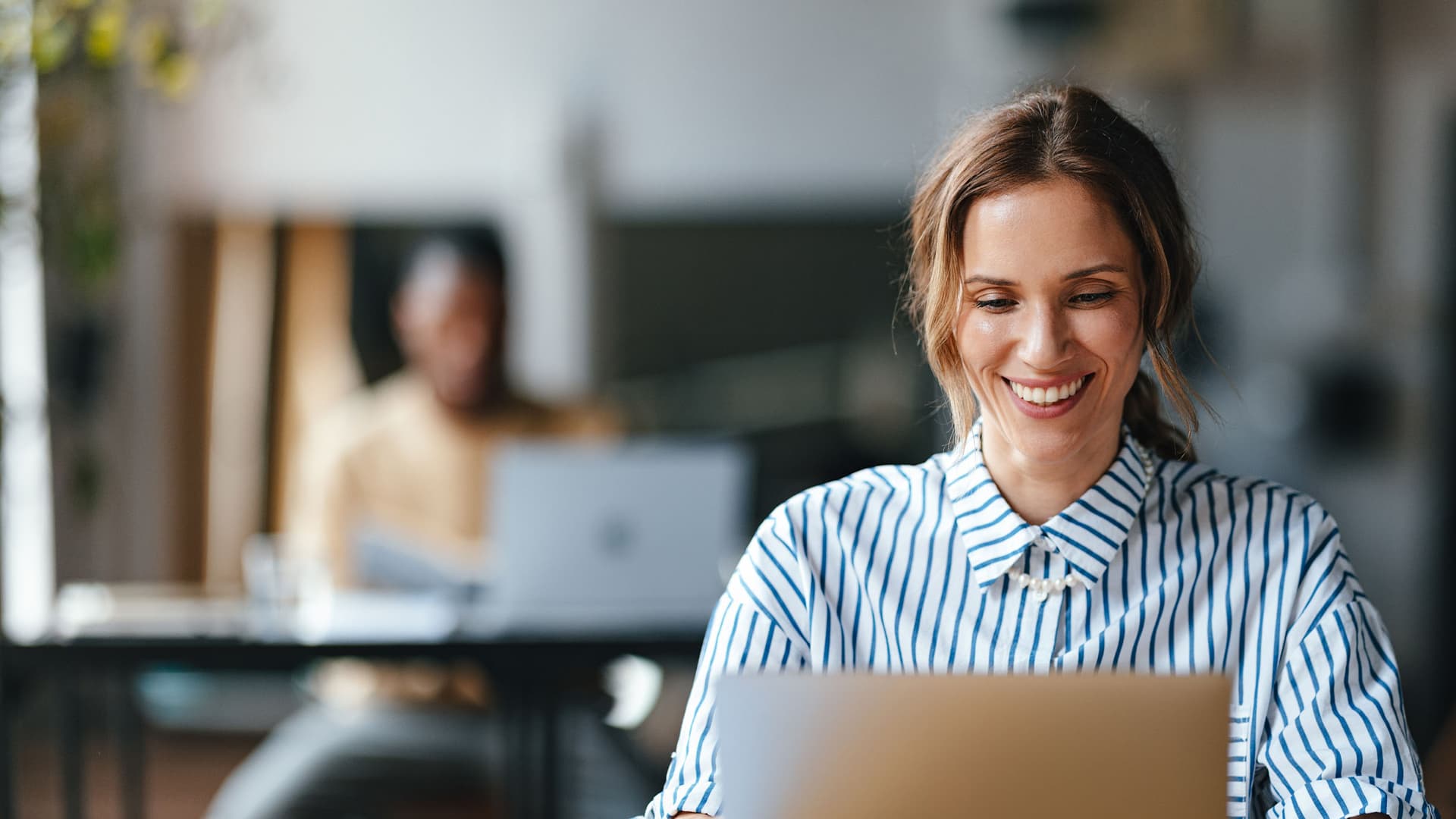 Women looking at a computer in an office
