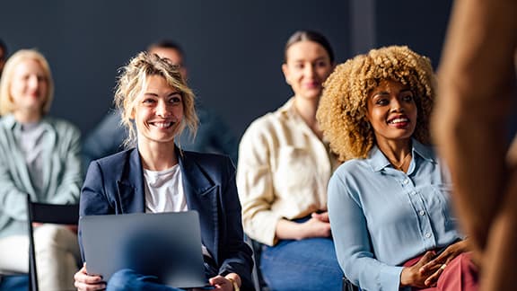 Two business women at a conference.