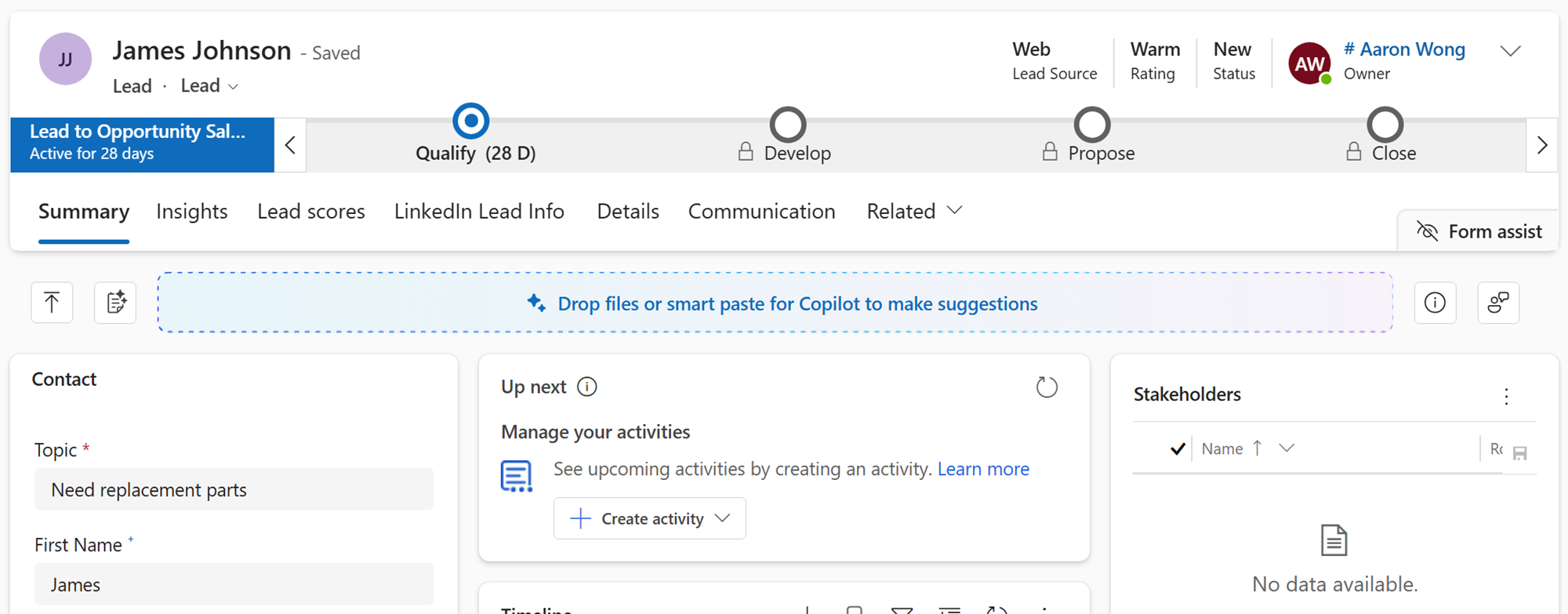 Screenshot of Dynamics 365 Sales interface showing a lead record with a blue box in the center labeled Drop files or smart paste for Copilot to make suggestions outlined in red.
