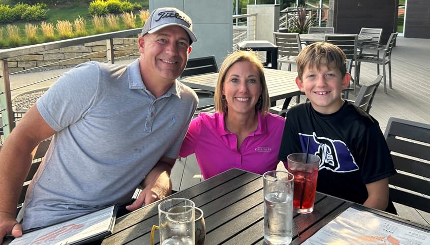 Kim Hamm and friend paddle boarding.