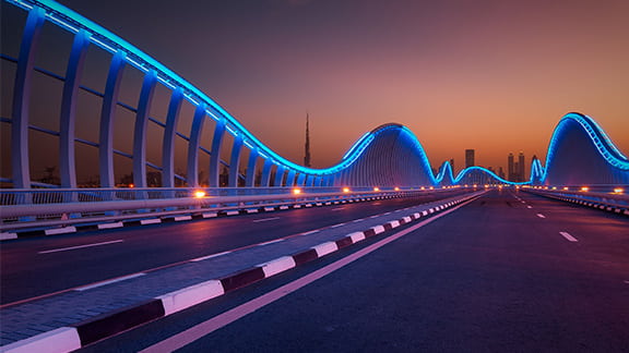 Dubai VIP bridge with a beautiful orange sunset.
