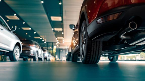 Rows of parked cars in a showroom for a car dealership