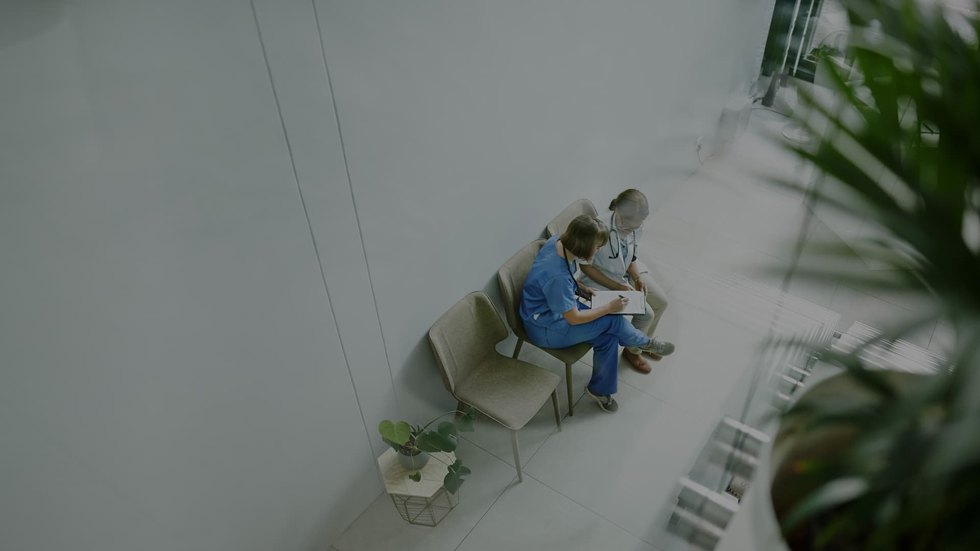 High angle shot of two young doctors having a discussion in a modern hospital