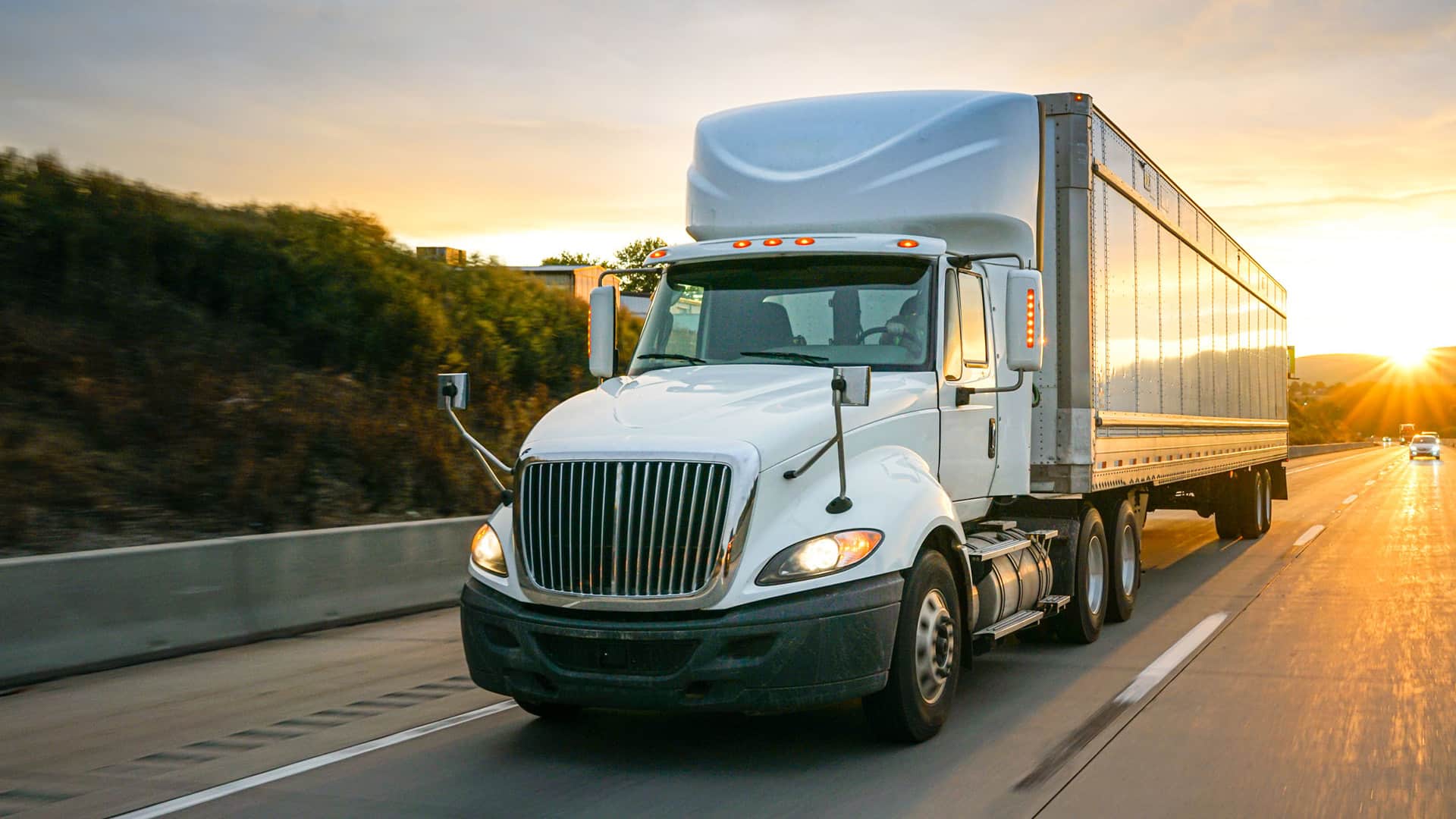 An 18 wheeler traveling on a highway