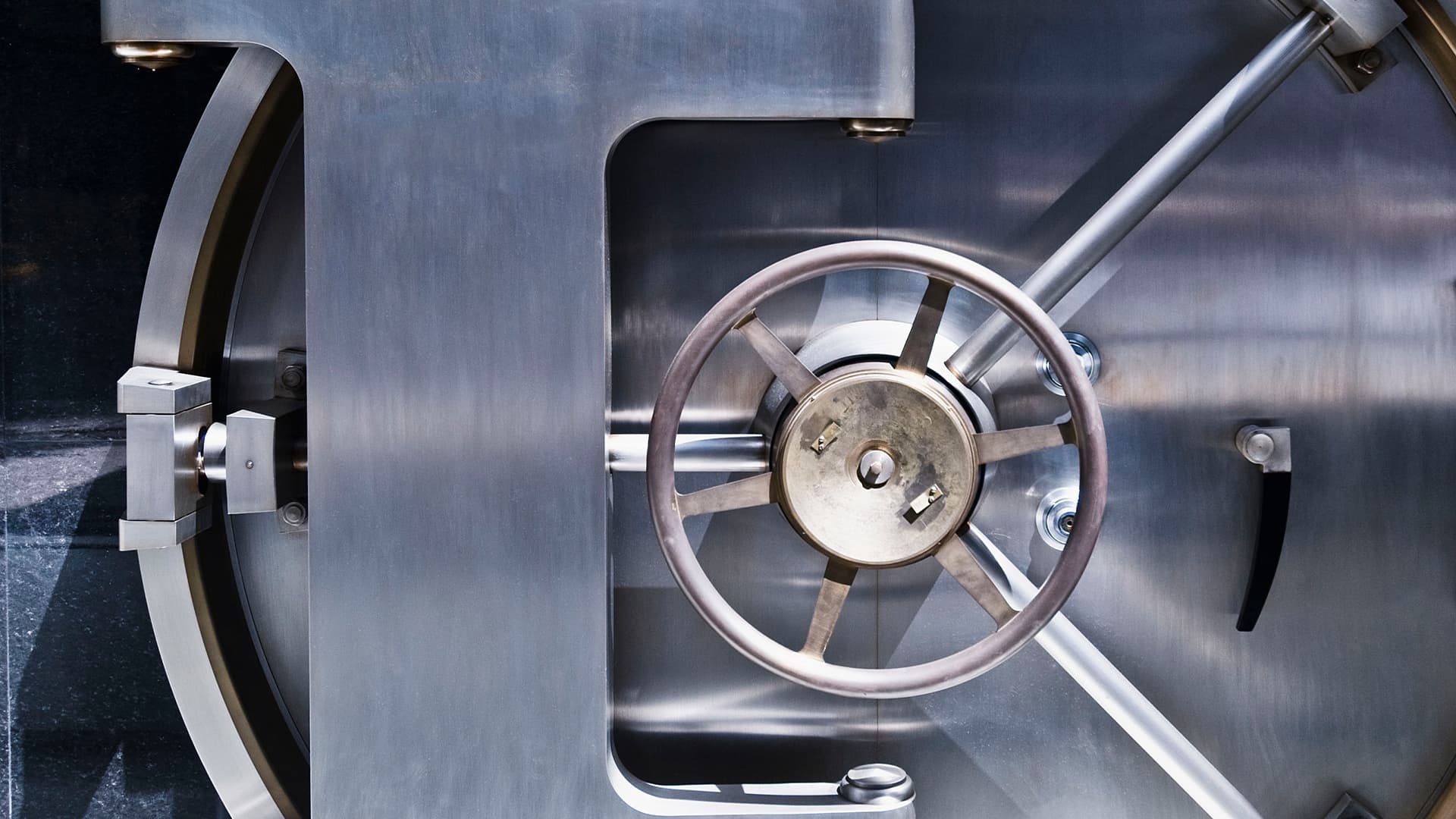 A giant safe that is silver and gold colored