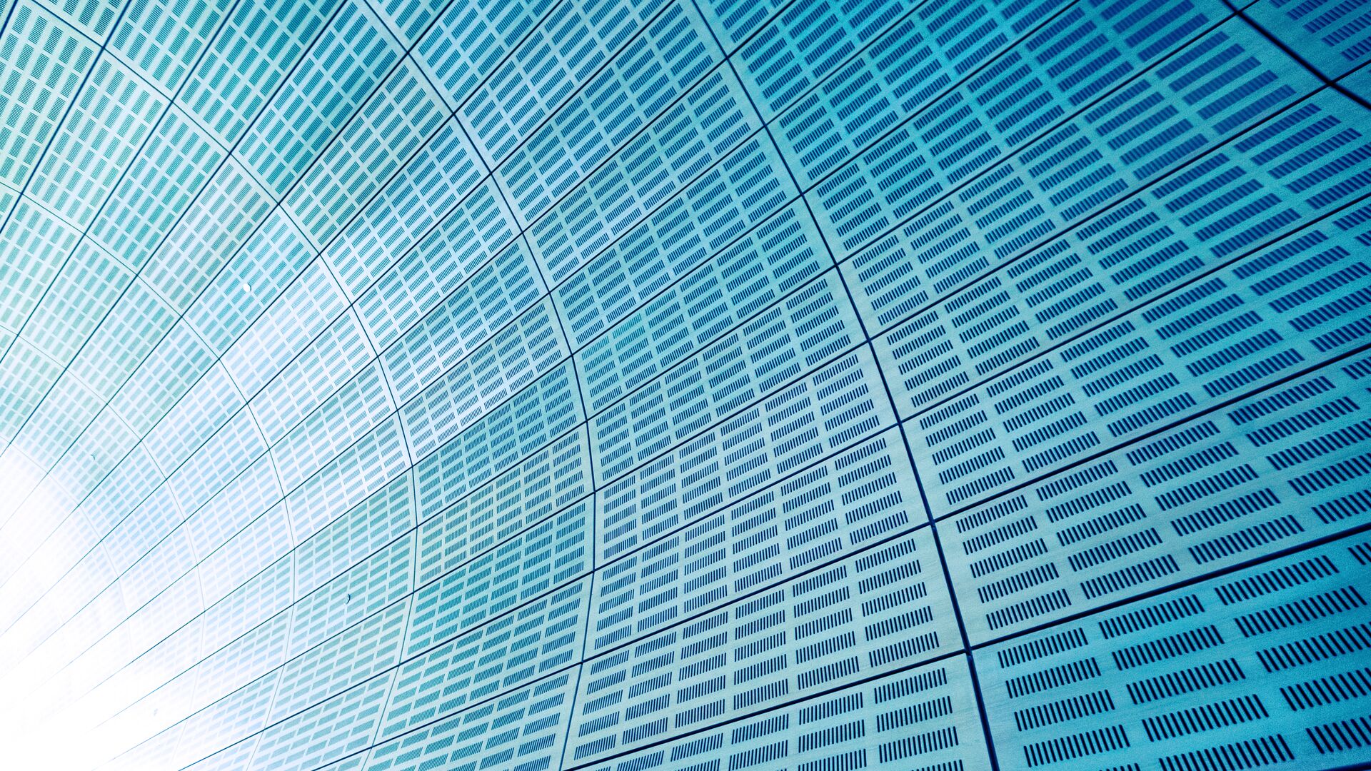 The sun reflecting off the Waved wall in Dubai, UAE.