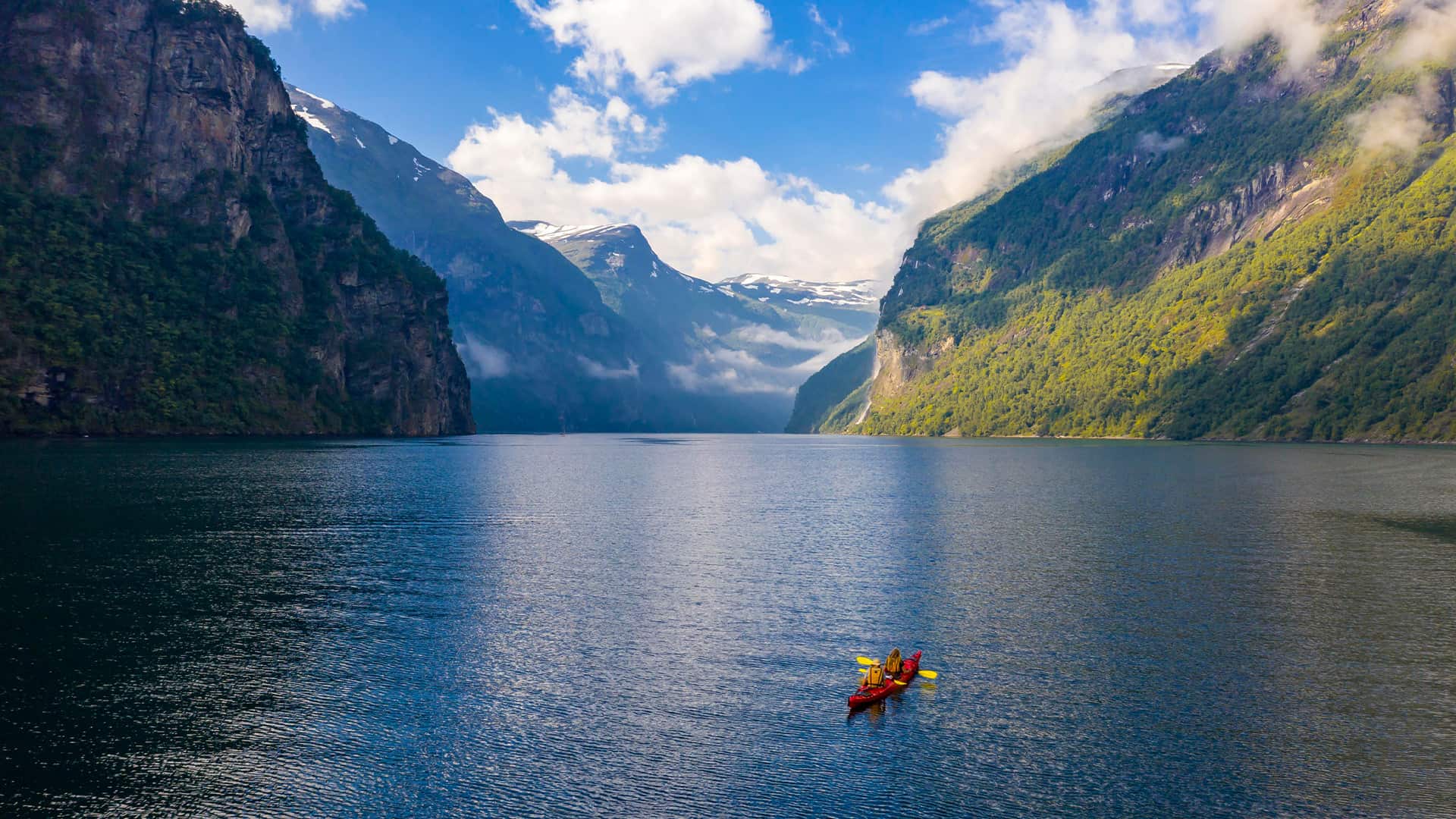 Red kayak in Geirangerfjord, near Geiranger, Moere og Romsdal, Norway