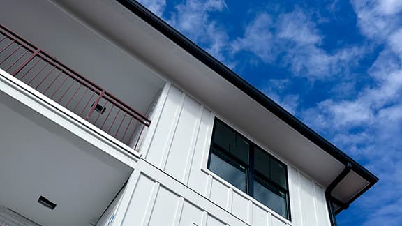 Exterior of a new build home on a sunny day.