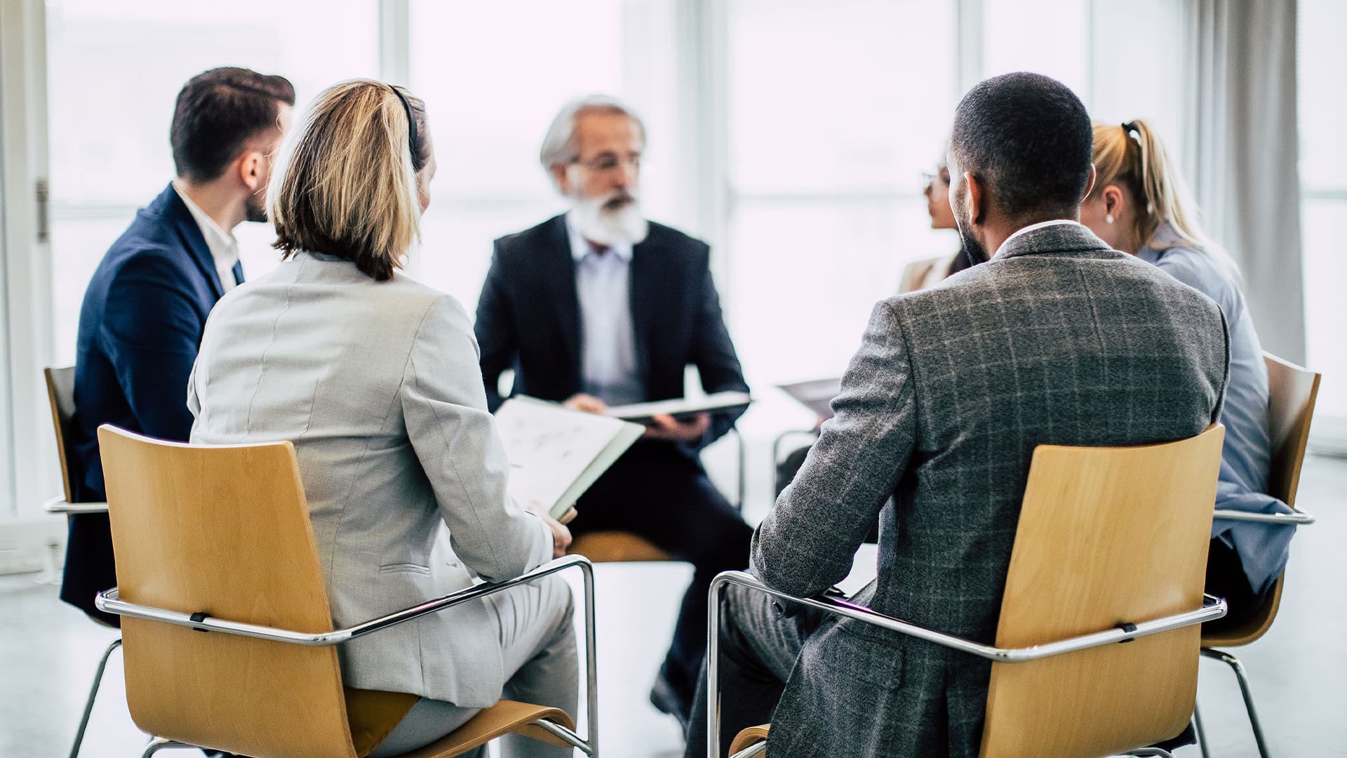 Professional healthcare workers meeting together in an office.