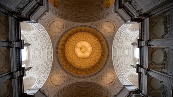 Dome ceiling with mosaic tiles at a court house in california.