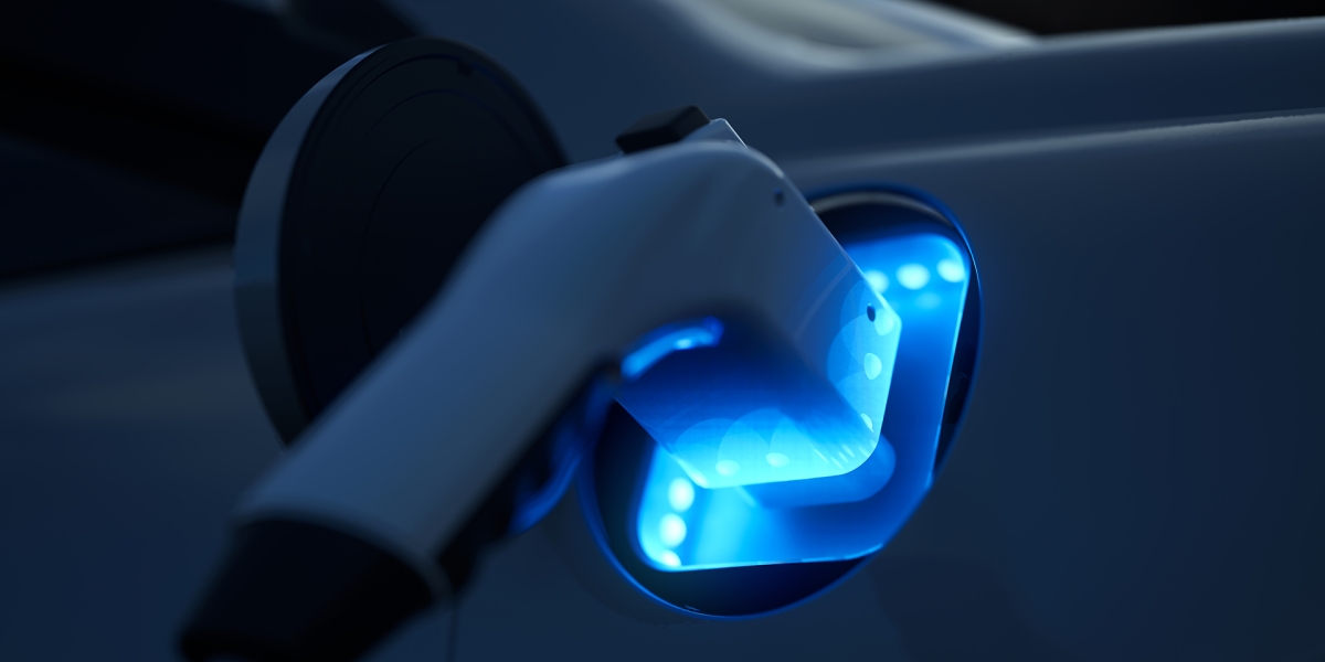 Close up of an electric vehicle charing.