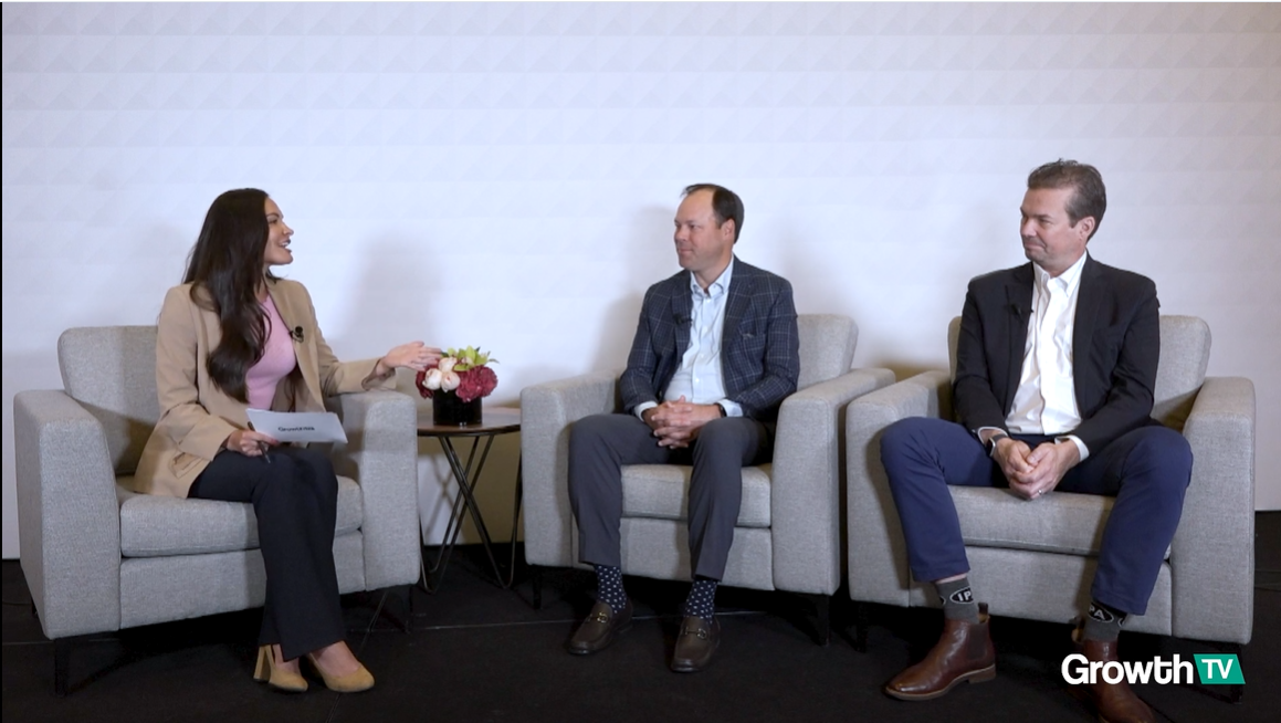three people sitting next to eachother during a discussion