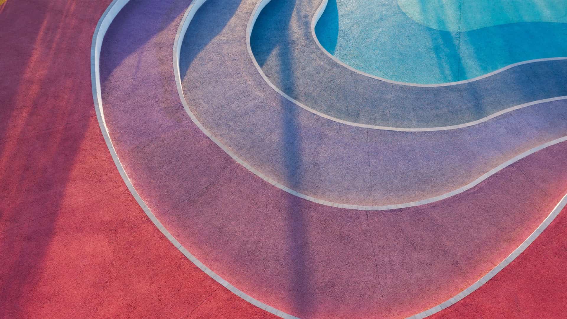 Stairs that are painted red, purple, and blue colors