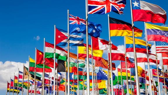 The flag of different countries waiving on flag poles