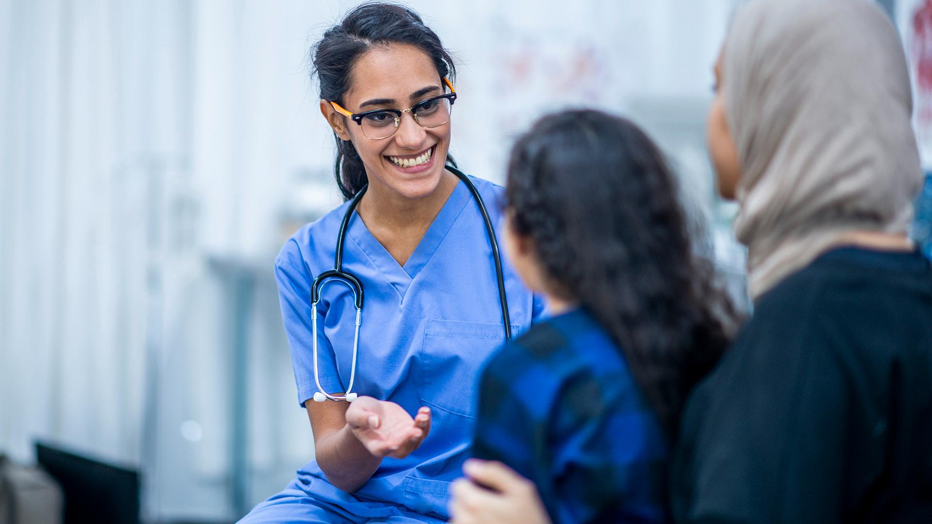 Nurse speaking to patients.