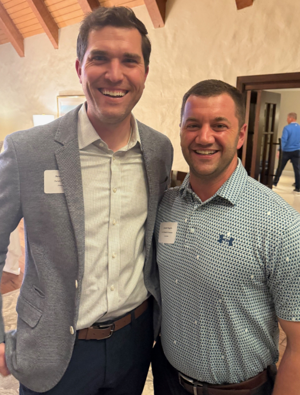 Joseph Higgins smiling with a friend