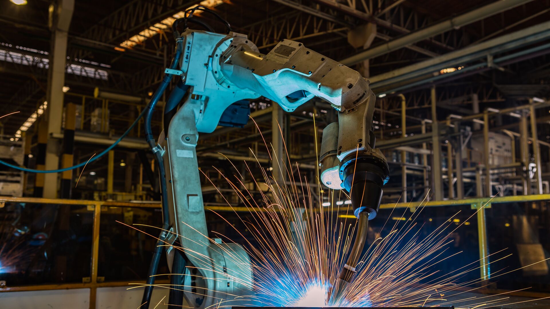 An industrial welding robot in a production line at a manufacturing factory