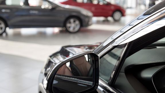 New cars in a dealer showroom.