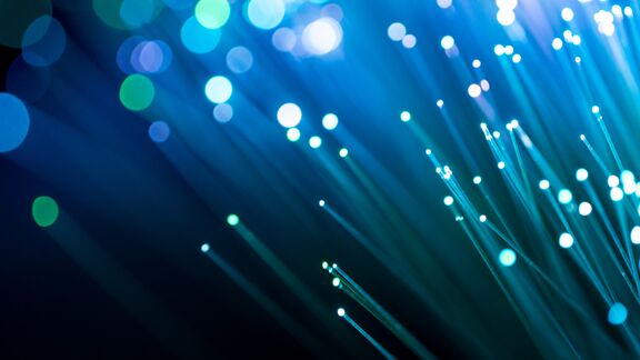 Abstract fiber optics that are glowing blue and green colors