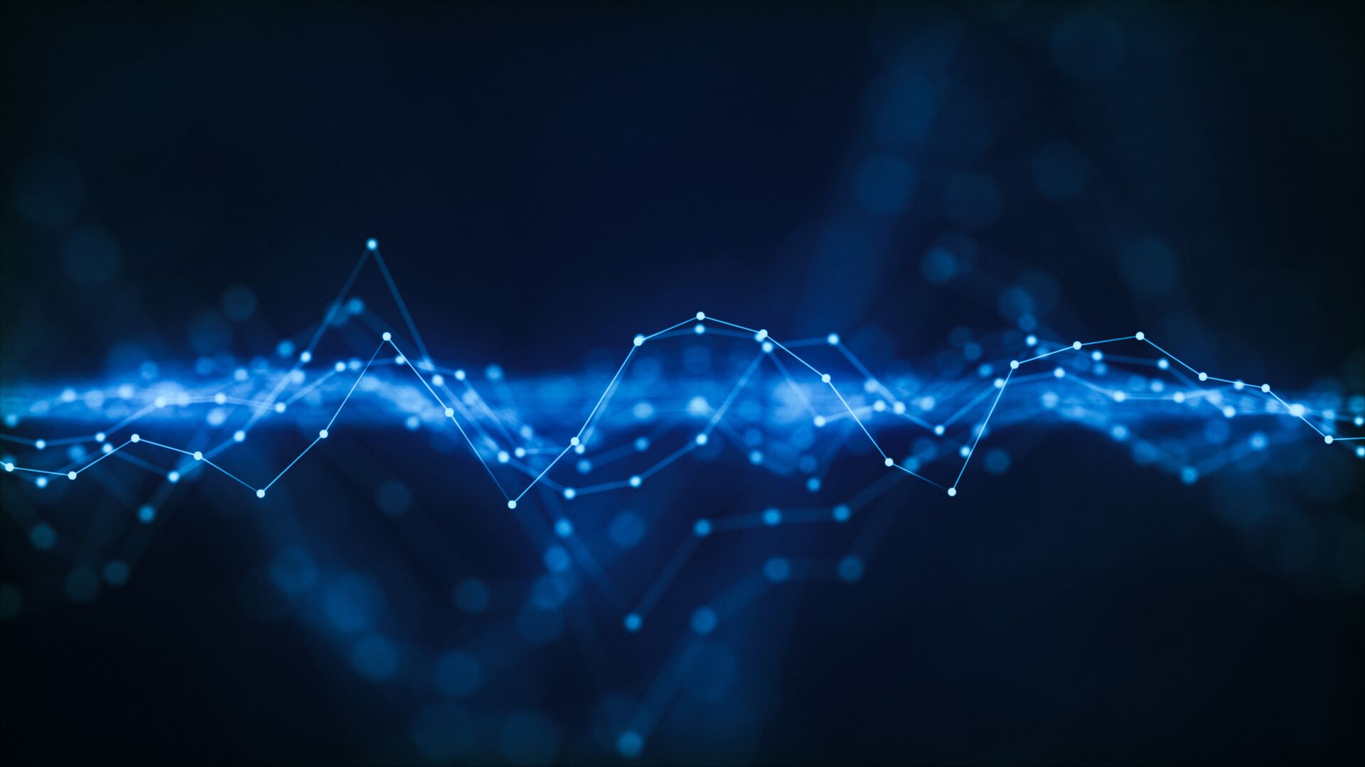 Abstract blue digital wave formed by glowing interconnected nodes and lines over a dark background.
