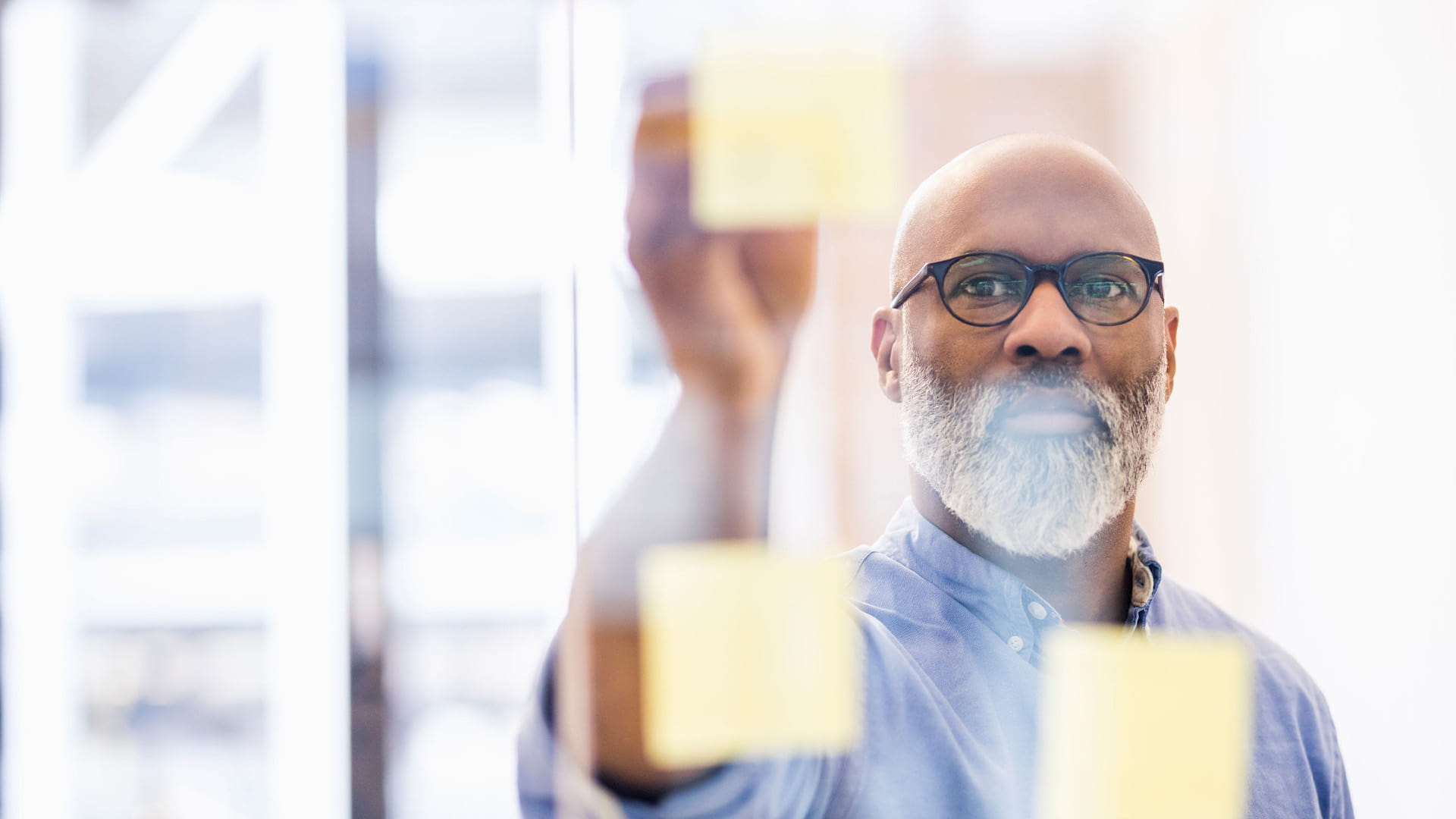 A man taking notes for the whole group to see.
