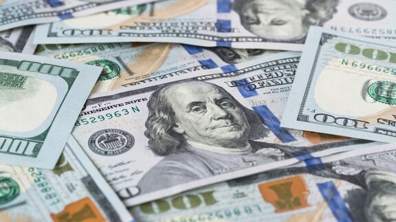 A spread out stack of 100 dollar bills