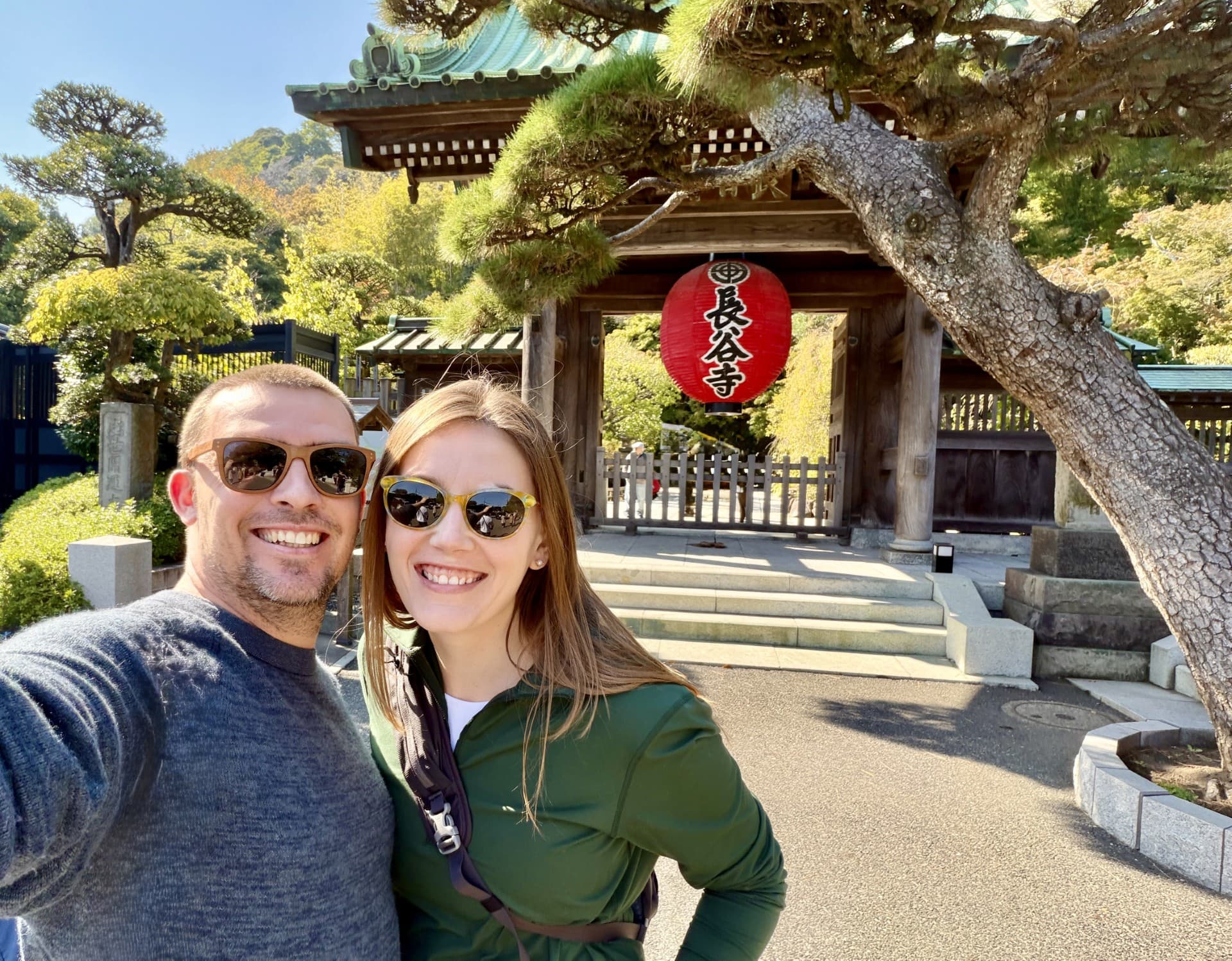 Kayla Reynolds and her husband in front of Asian architecture.
