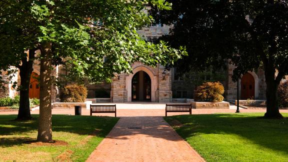 A brick walkway that's leading to an educational building at Boston College