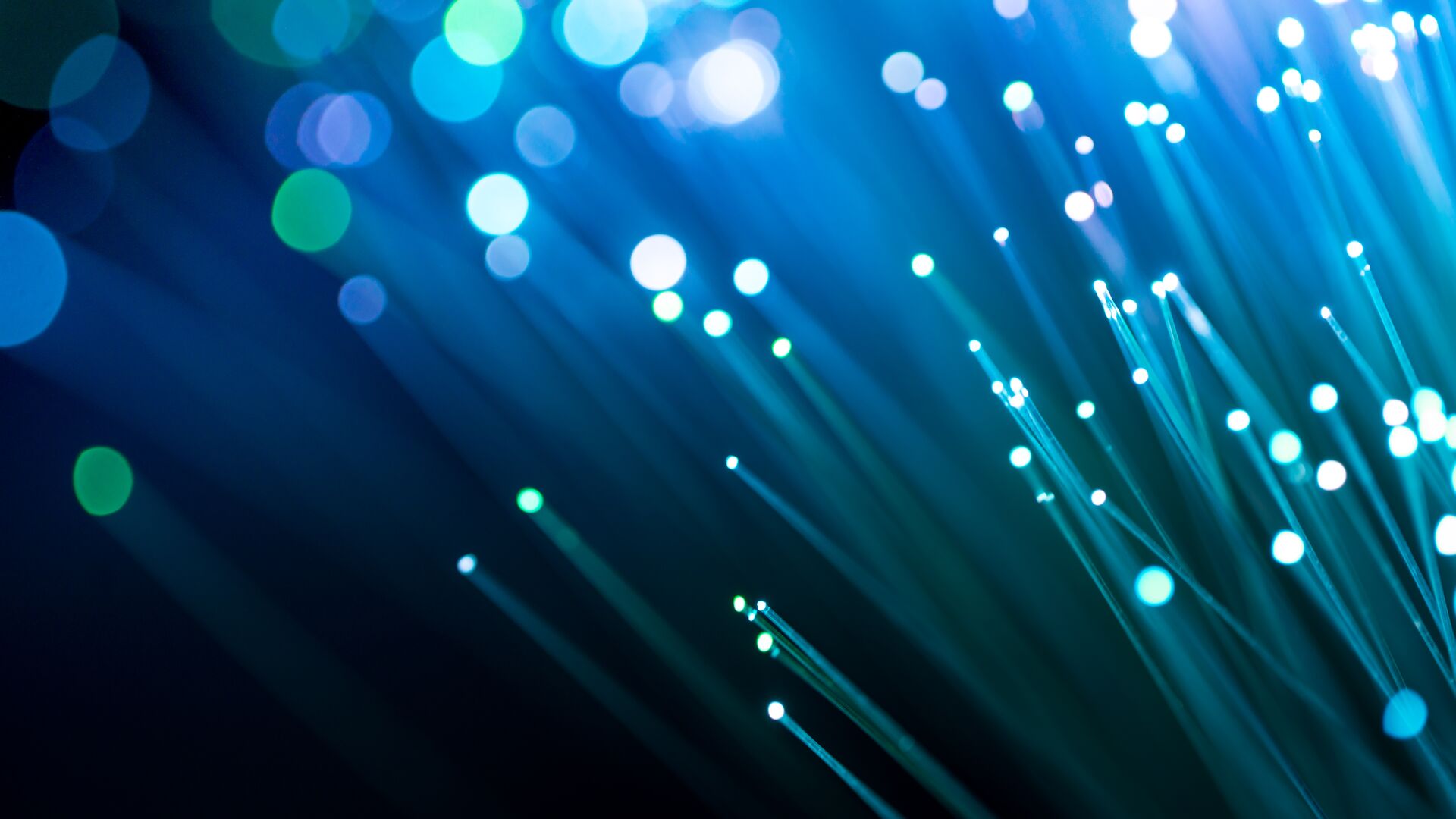 Abstract fiber optics that are glowing blue and green colors